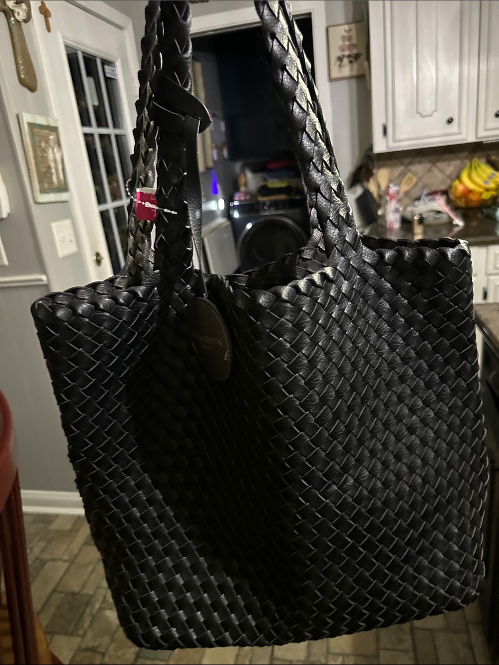 Isle Jacobson Braided Black Tote Bag with Braided Handles retails $130.